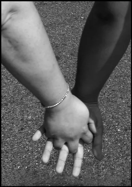 Two people's hands holding